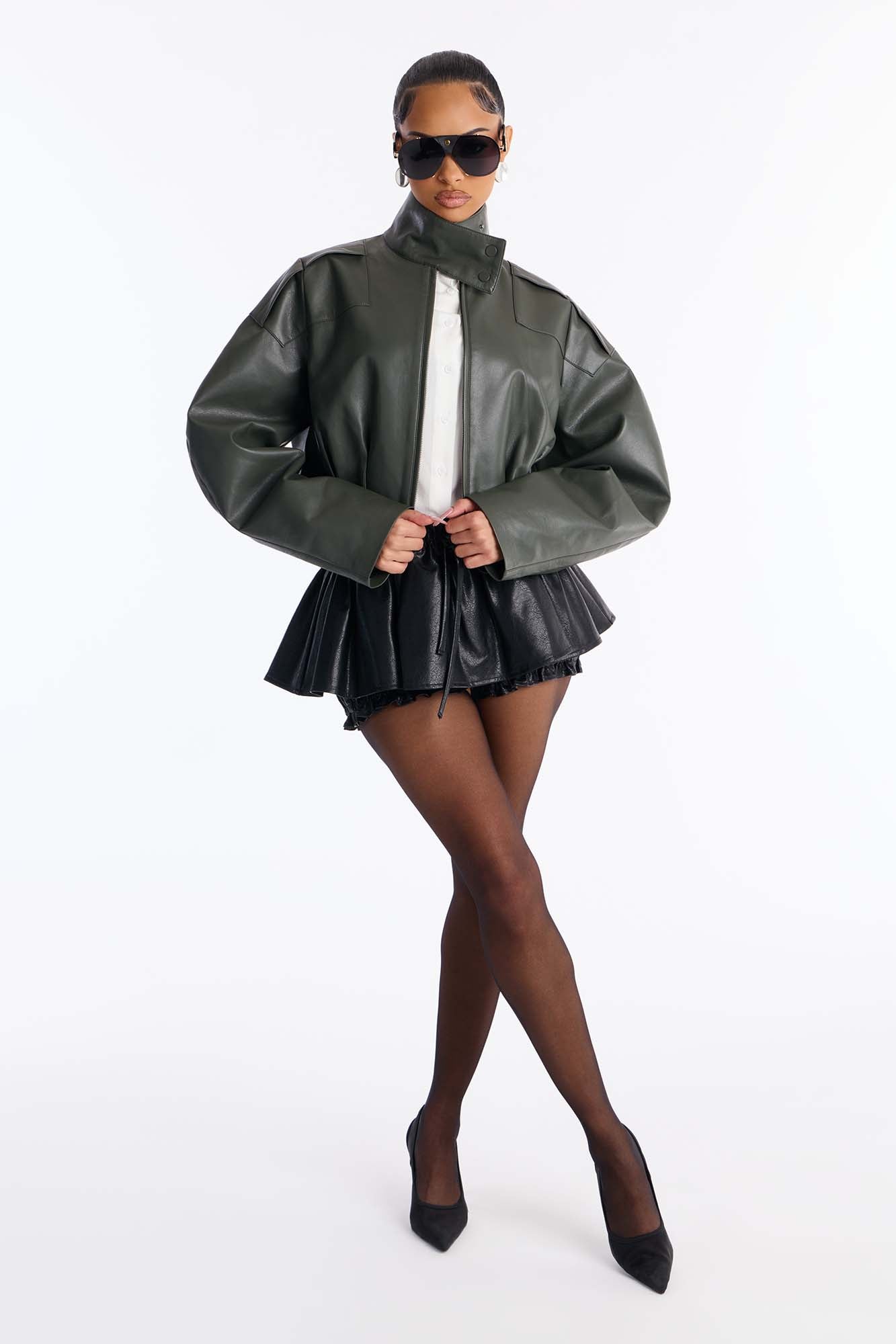 I'm A Flirt Pleated Faux Leather Peekaboo Micro Skort - Black